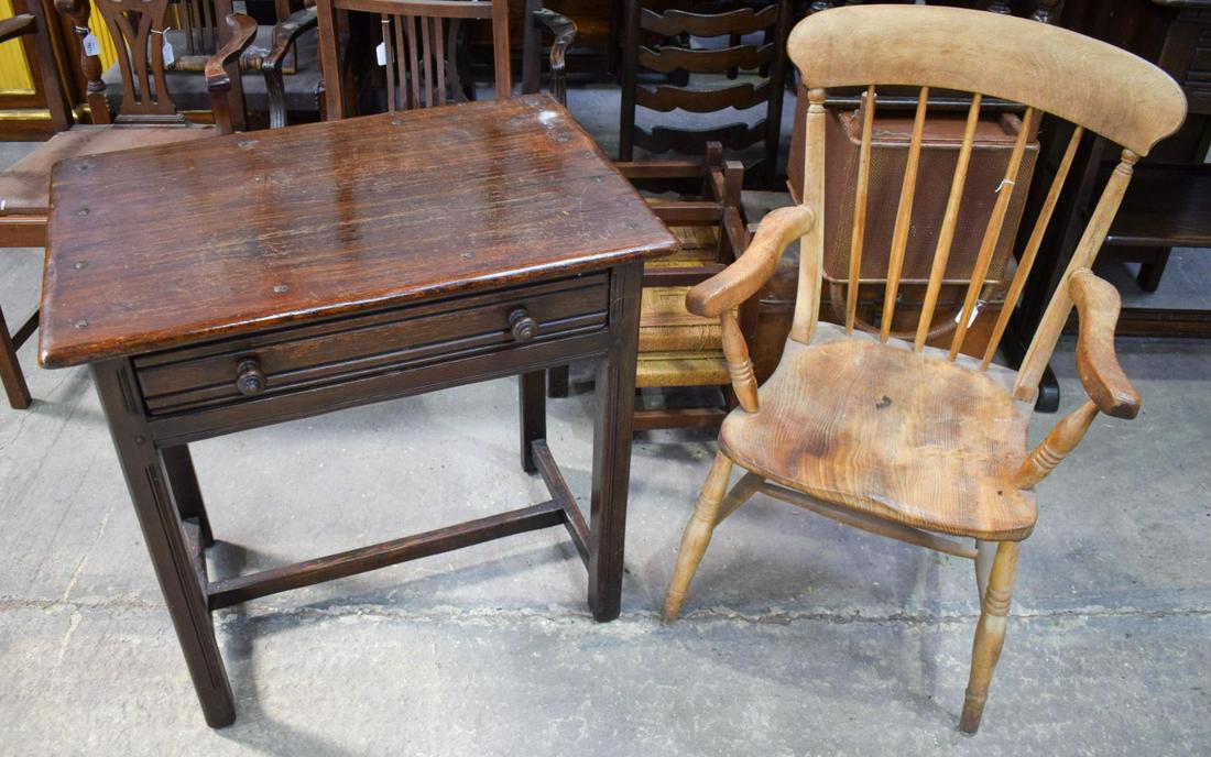 A VINTAGE SMOKERS CHAIR and an Ercol style side table.: A VINTAGE SMOKERS CHAIR and an Ercol style side table. (2)