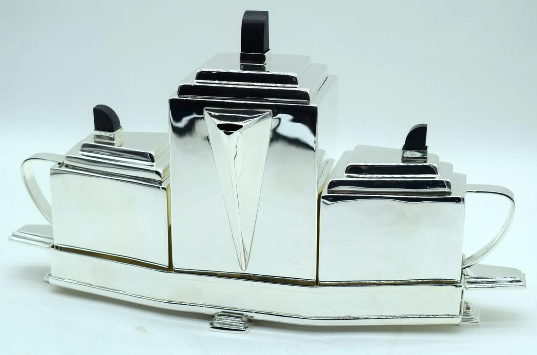 An Art Deco style silver plated tea set. 22 x 40cm. (1 of 5)