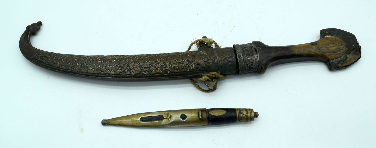 A middle Eastern wooden handled dagger with a copper (1 of 7)