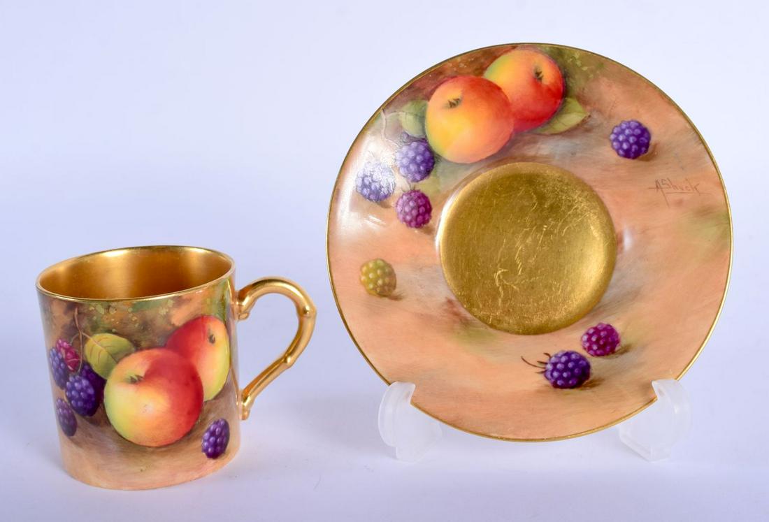 Royal Worcester coffee can and saucer painted with: Royal Worcester coffee can and saucer painted with fruit by A. Shuck, signed, date code for 1939. Cup 5cm High. Saucer 11cm Diameter