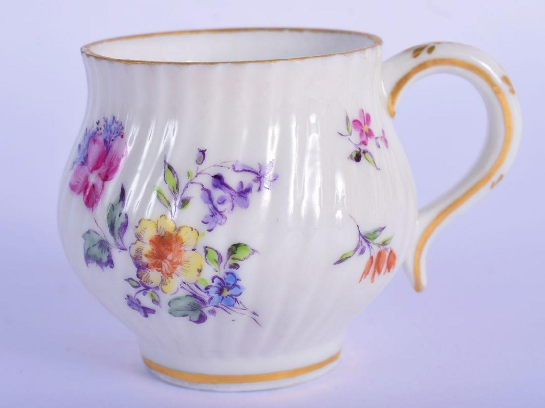 AN 18TH CENTURY GERMAN RIBBED PORCELAIN CUSTARD CUP: AN 18TH CENTURY GERMAN RIBBED PORCELAIN CUSTARD CUP Meissen style, painted with floral sprays. 6.5 cm wide.