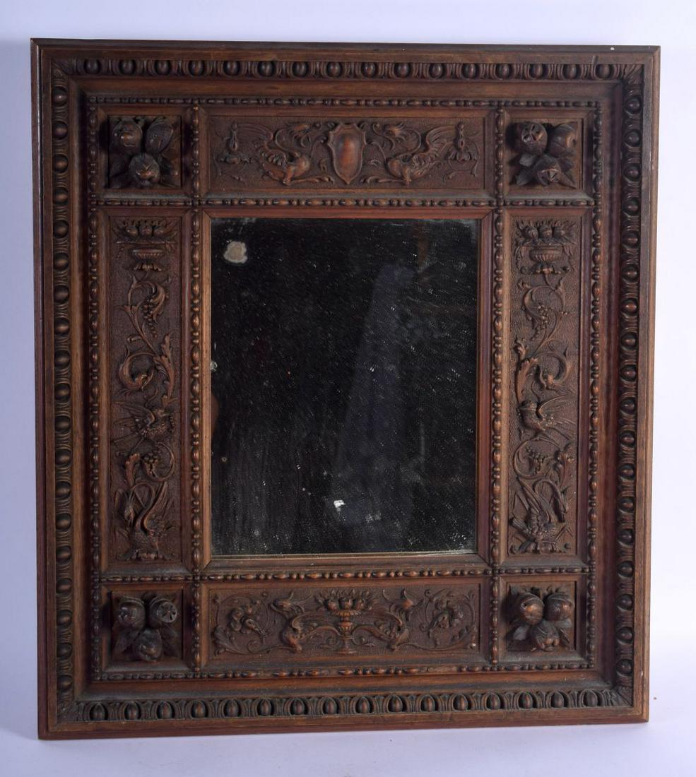 AN ANTIQUE EUROPEAN CARVED WOOD MIRROR decorated with (1 of 6)