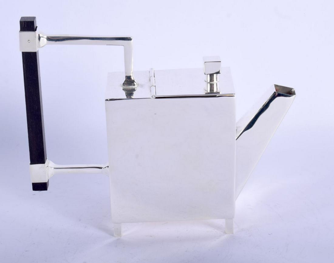 A CHRISTOPHER DRESSER STYLE SILVER PLATED TEAPOT AND: A CHRISTOPHER DRESSER STYLE SILVER PLATED TEAPOT AND COVER. 18 cm wide.