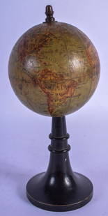 AN ANTIQUE MAISON FOREST GLOBE TERRESTRE upon an: AN ANTIQUE MAISON FOREST GLOBE TERRESTRE upon an ebonised base. 16.5 cm high.