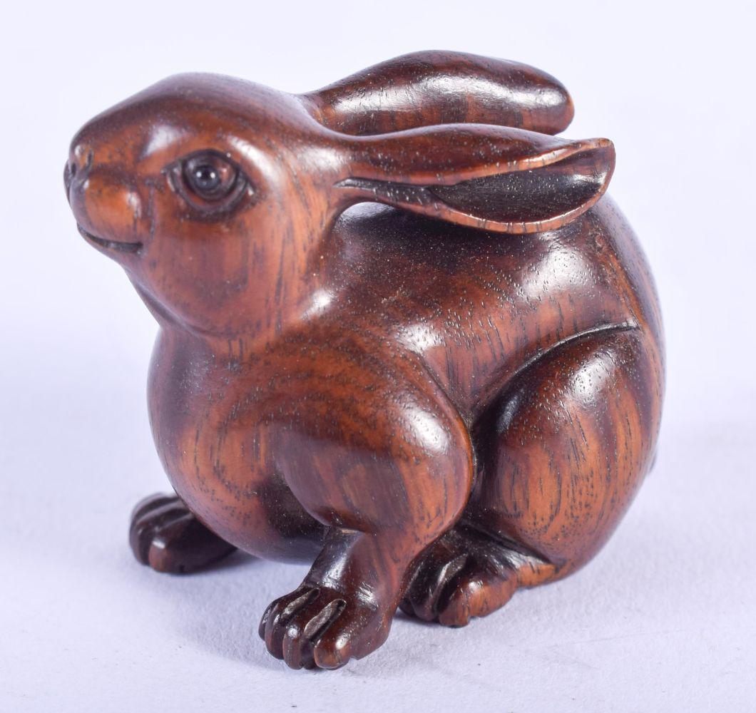 JAPANESE WOOD NETSUKE IN THE FORM OF A RABBIT. 3.5cm x: JAPANESE WOOD NETSUKE IN THE FORM OF A RABBIT. 3.5cm x 3.5cm