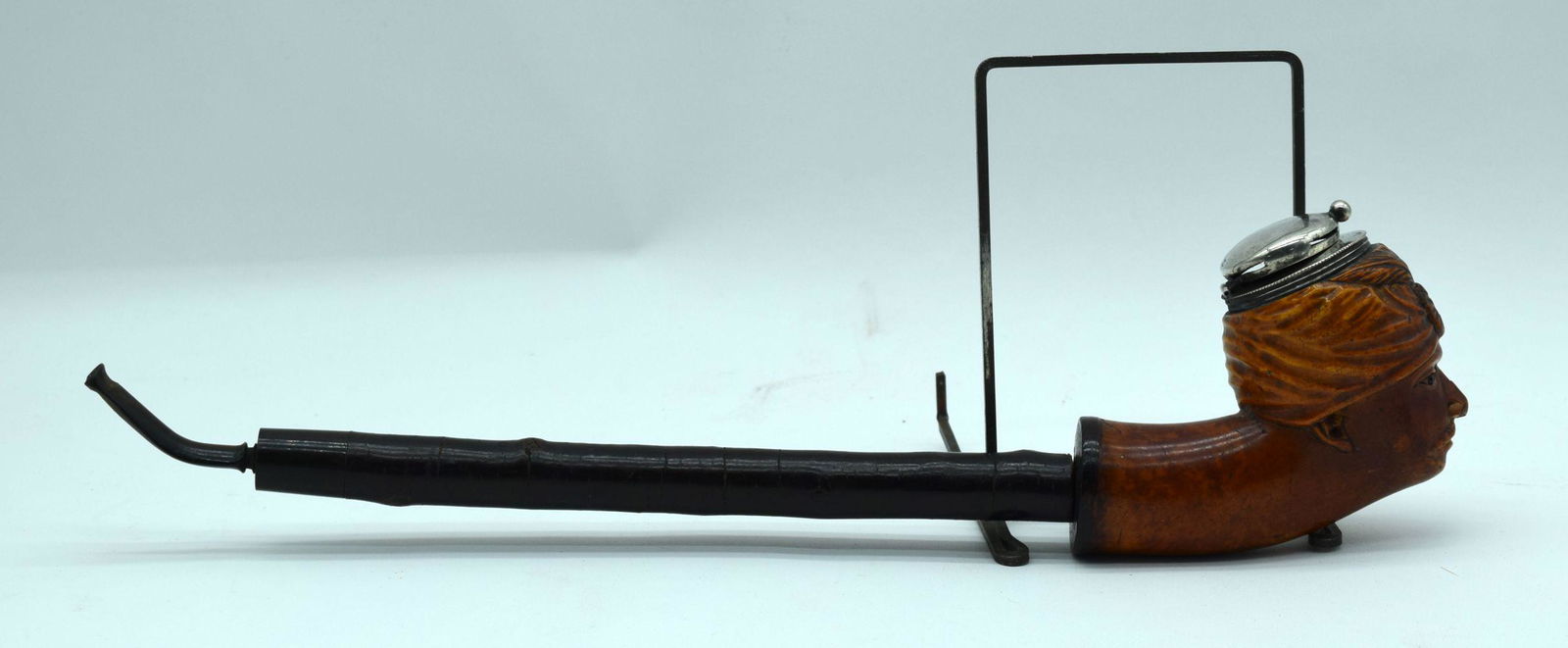 An antique  Briar wood pipe carved with an Indian male, (1 of 5)