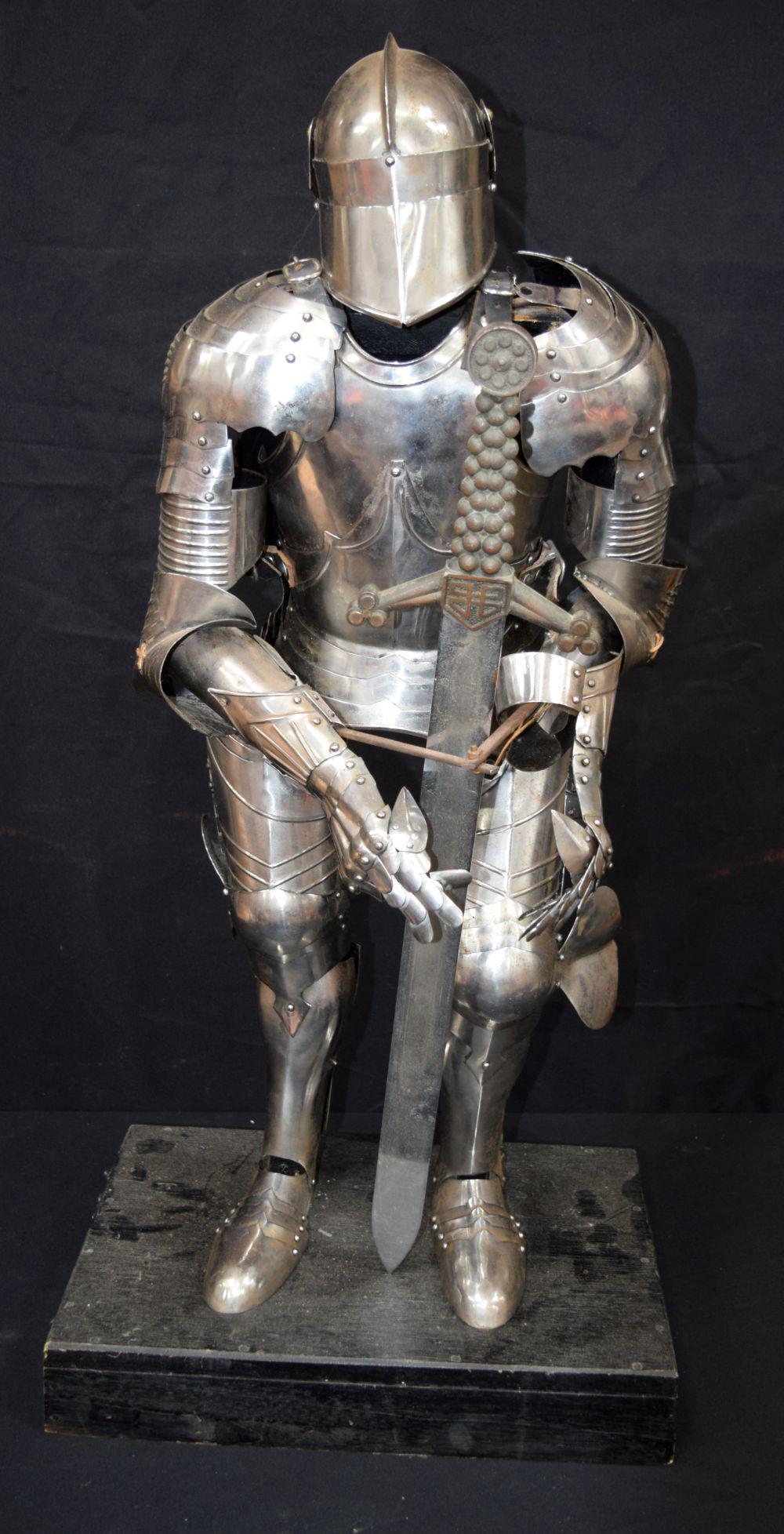 A small size contemporary  Suit of Armour on a stand (1 of 3)