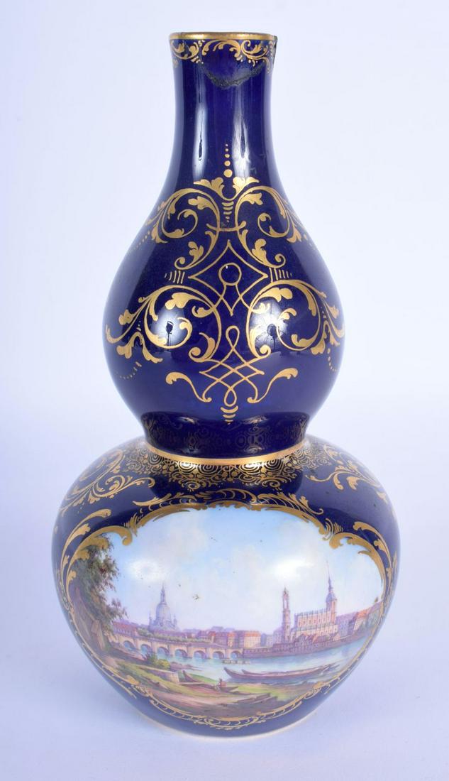 A 19TH CENTURY MEISSEN PORCELAIN GOURD FORM VASE: A 19TH CENTURY MEISSEN PORCELAIN GOURD FORM VASE painted with a view of Dresden. 18 cm high.