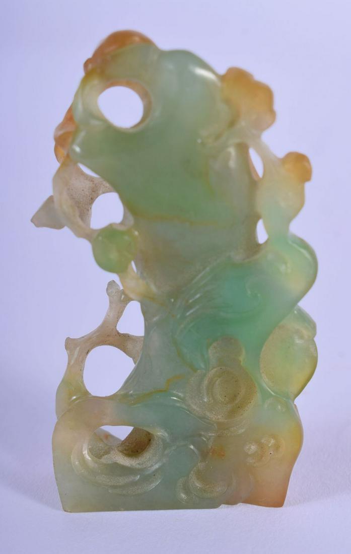 AN EARLY 20TH CENTURY CHINESE CARVED JADE FIGURE OF A (1 of 3)