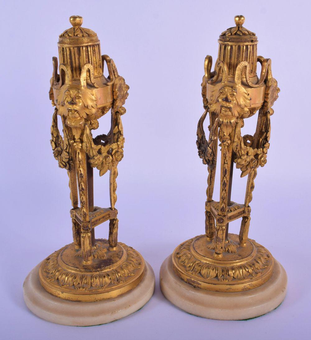 A PAIR OF LATE 18TH CENTURY EUROPEAN ORMOLU MANTEL: A PAIR OF LATE 18TH CENTURY EUROPEAN ORMOLU MANTEL STICKS formed with unusual mask heads and draped acanthus. 21 cm high.