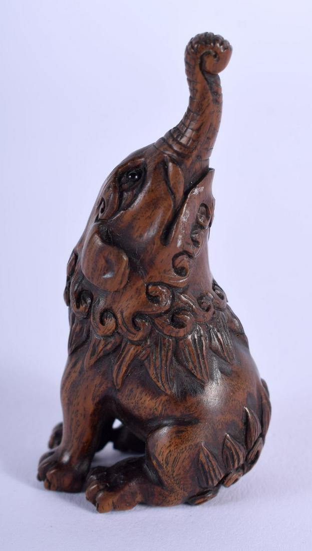 A JAPANESE TAISHO PERIOD CARVED WOOD NETSUKE modelled (1 of 4)