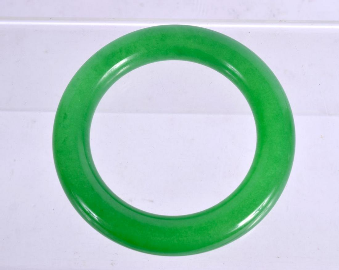 A CHINESE CARVED JADE BANGLE 20th Century. 81 grams. 7 (1 of 2)