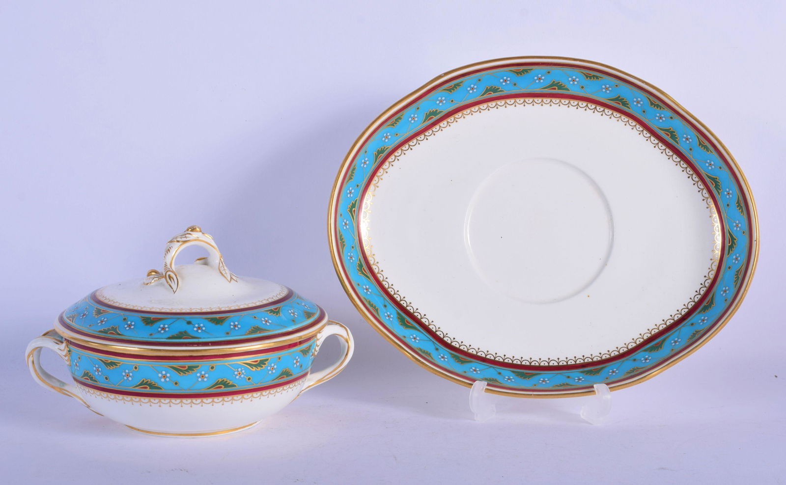 Minton ecuelle, cover and stand with painted border: Minton ecuelle, cover and stand with painted border decorated in the style of Sir Christopher Dresser c. 1880’s. Ecuelle 11cm High, Stand 24cm Long (2)