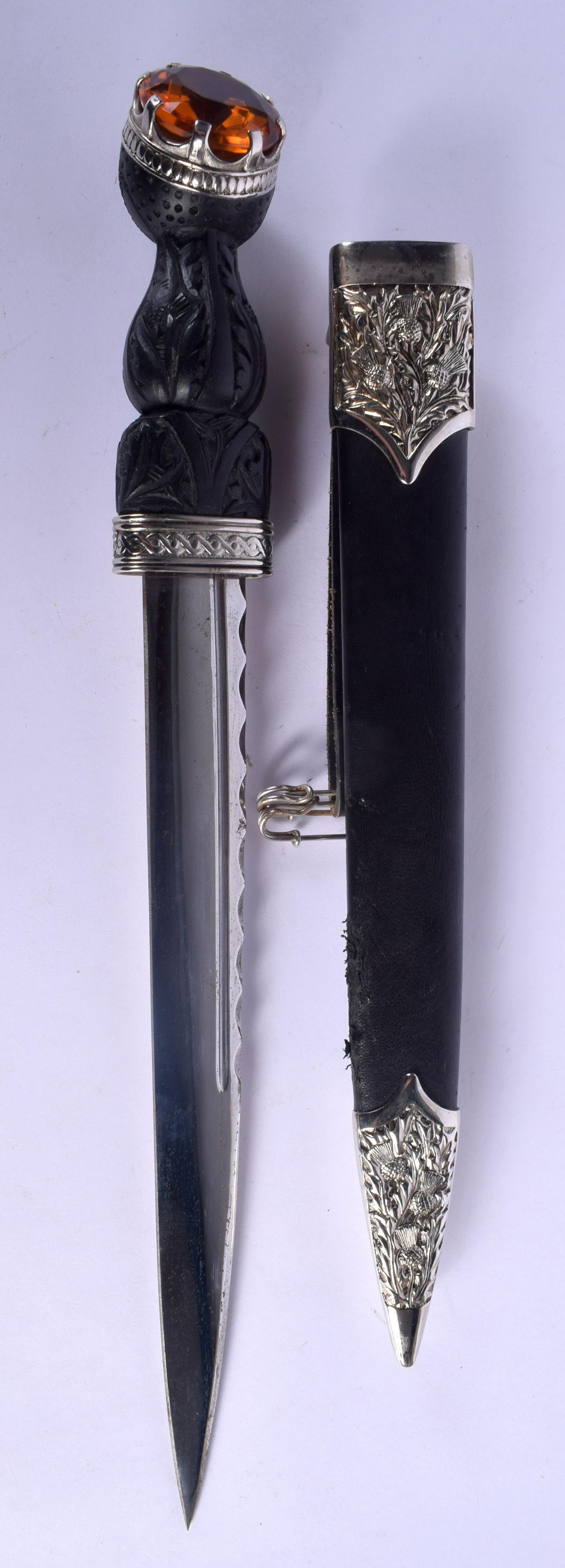 A SCOTTISH WHITE METAL MOUNTED CITRINE DIRK DAGGER with (1 of 4)