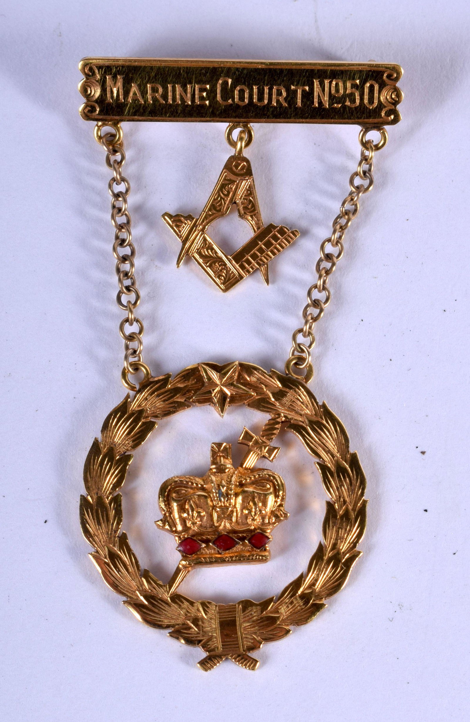 A MASONIC MEDAL INSCRIBED MARINE COURT NO 50,PRESENTED: A MASONIC MEDAL INSCRIBED MARINE COURT NO 50,PRESENTED TO JOHN WALKER IN 1951/52. 6.2cm x 3.3cm, weight 9.8g