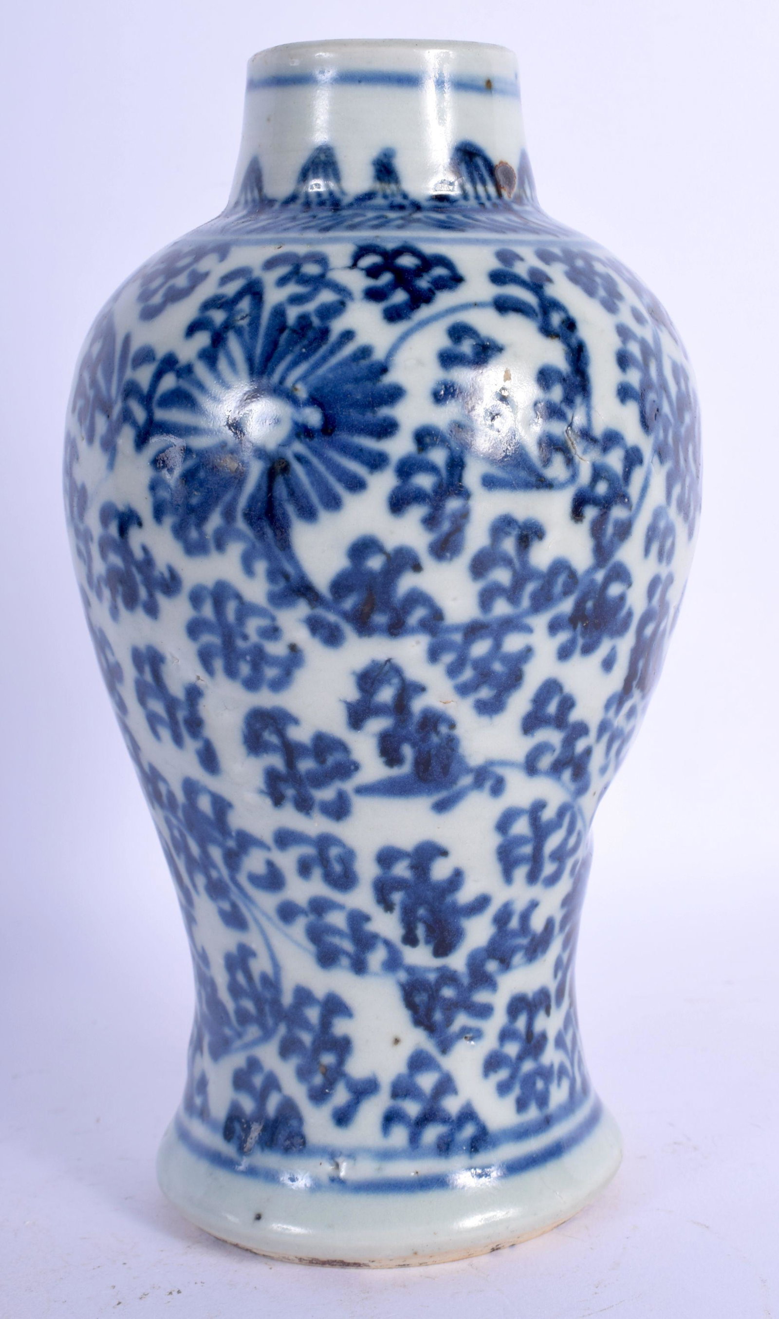 AN EARLY 18TH CENTURY CHINESE BLUE AND WHITE PORCELAIN: AN EARLY 18TH CENTURY CHINESE BLUE AND WHITE PORCELAIN VASE Yongzheng, painted with floral sprays and vines. 18 cm high.