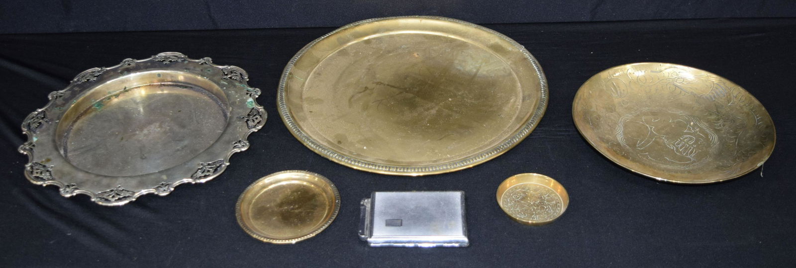 A large brass tray together with other brass items and: A large brass tray together with other brass items and a plated tray etc 36cm (6).