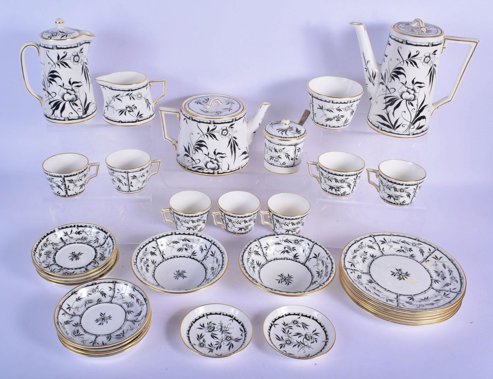 A VINTAGE HAMMERSLEY & CO BLACK AND WHITE PORCELAIN: A VINTAGE HAMMERSLEY & CO BLACK AND WHITE PORCELAIN TEASET decorated with foliage. Largest 19 cm x 19 cm. (qty)