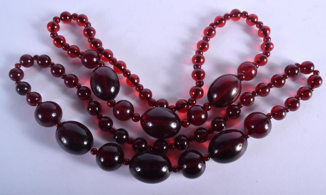 A PAIR OF ART DECO CHERRY AMBER TYPE NECKLACES. 260 (1 of 2)