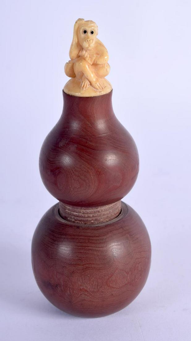 A JAPANESE BOXWOOD AND BONE MONKEY GOURD BOTTLE. 66: A JAPANESE BOXWOOD AND BONE MONKEY GOURD BOTTLE. 66 grams. 11 cm x 4 cm.