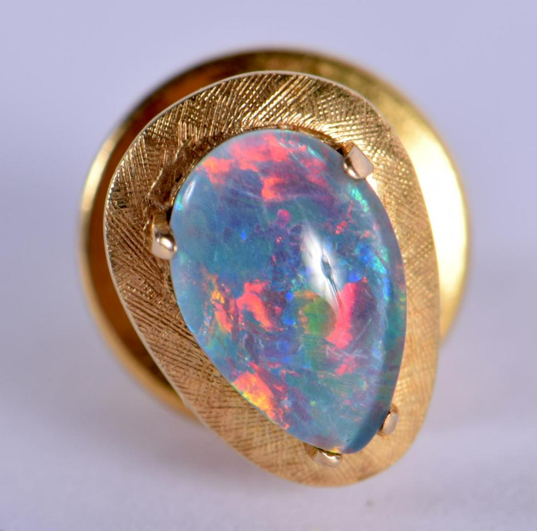 A GOLD AND OPAL TIE PIN. 2.5 grams. 1 cm x 0.75 cm. (1 of 2)