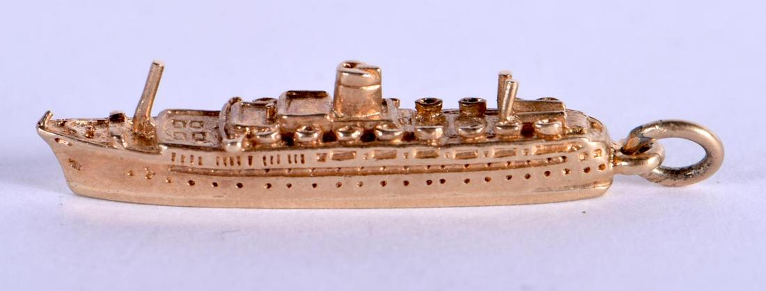 A 9CT GOLD BOAT CHARM. 3.4 grams. 3.25 cm x 0.5 cm. (1 of 3)