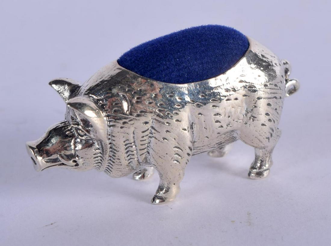 A STERLING SILVER PIN CUSHION IN THE FORM OF A PIG. (1 of 3)