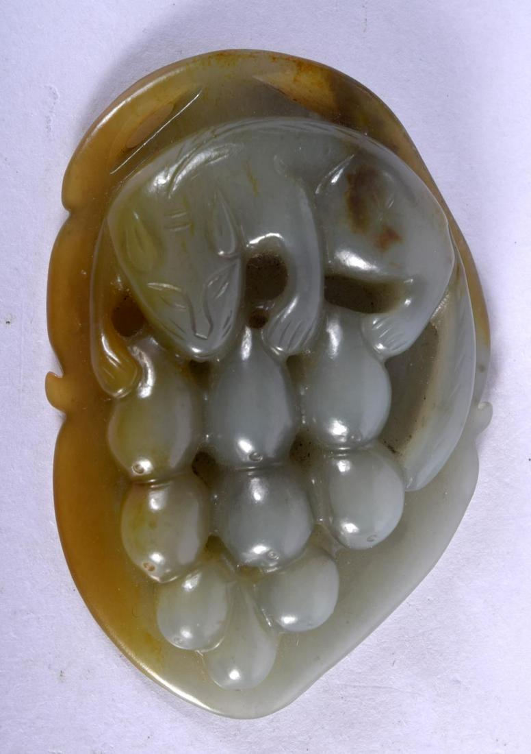AN EARLY 20TH CENTURY CHINESE CARVED GREEN JADE LEAF: AN EARLY 20TH CENTURY CHINESE CARVED GREEN JADE LEAF Late Qing/Republic, modelled as a squirrel with grapes. 5.5 cm x 3.5 cm.