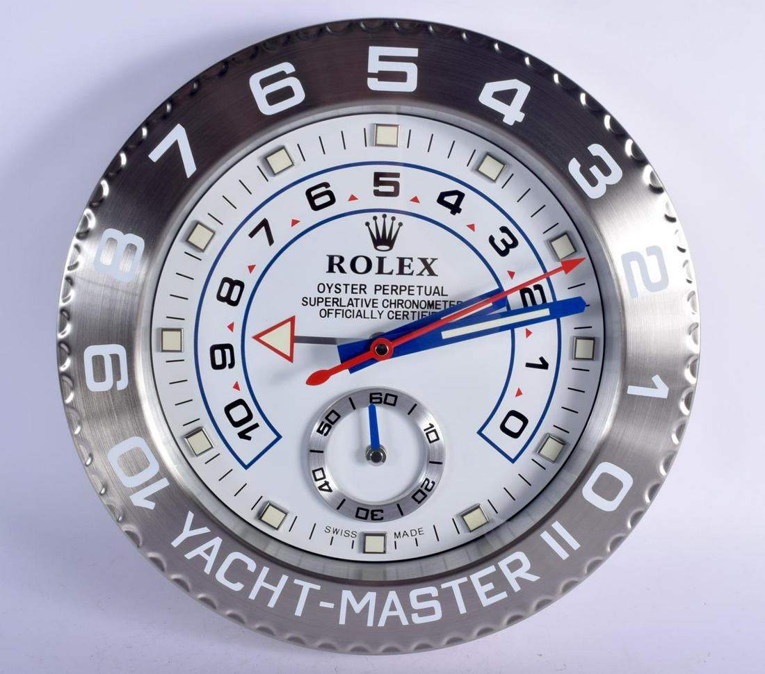 A ROLEX SHOP DISPLAY ADVERTISING WALL CLOCK. 33 cm: A ROLEX SHOP DISPLAY ADVERTISING WALL CLOCK. 33 cm diameter.