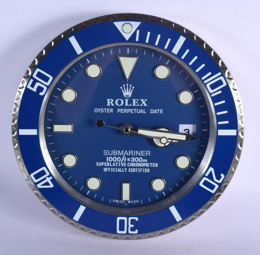 A ROLEX SHOP DISPLAY ADVERTISING WALL CLOCK. 33 cm: A ROLEX SHOP DISPLAY ADVERTISING WALL CLOCK. 33 cm diameter.