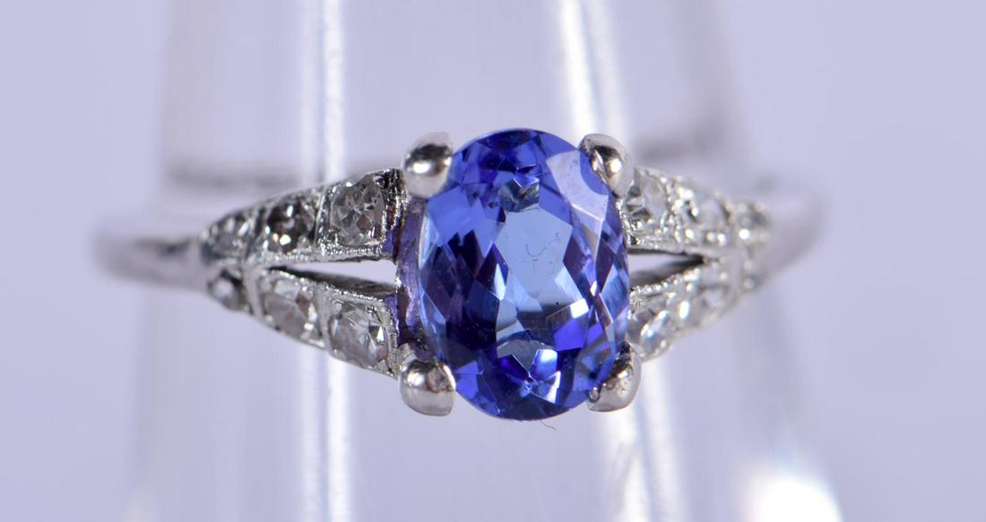 A PLATINUM, TANZANITE AND DIAMOND RING.  Size J, weight (1 of 3)