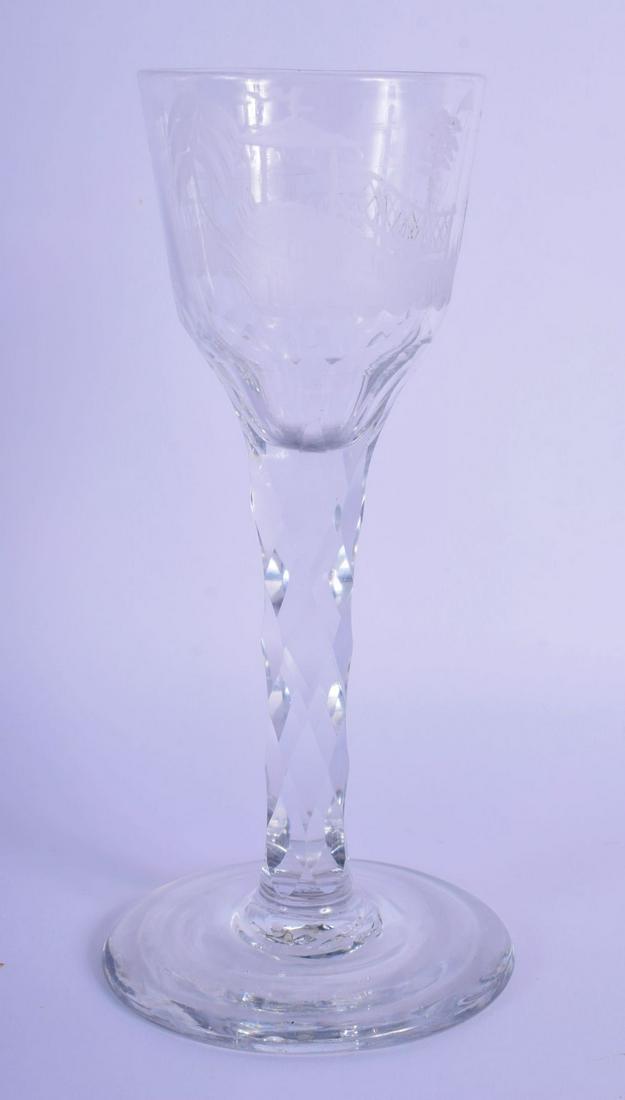 A GEORGE III GLASS engraved with chinoiserie figures in: A GEORGE III GLASS engraved with chinoiserie figures in landscapes. 15 cm high.