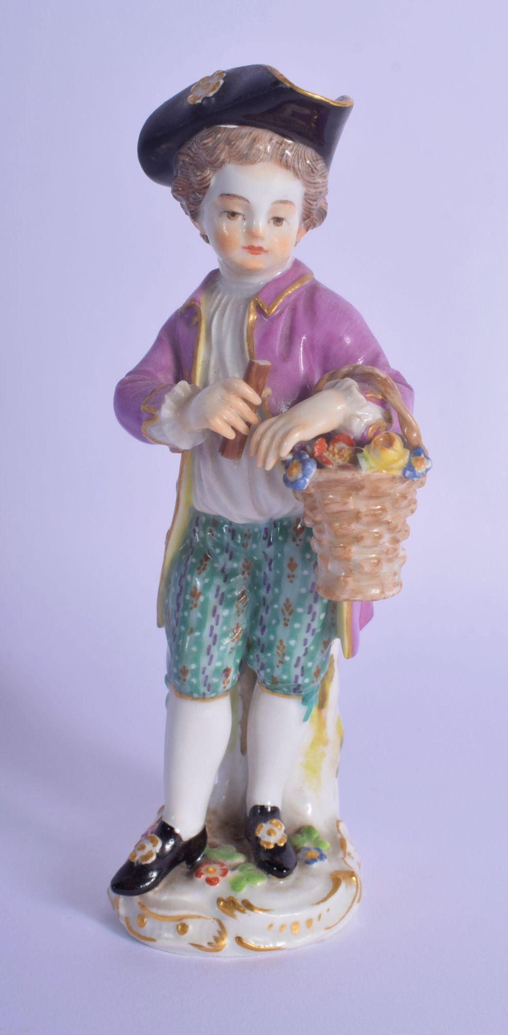 AN ANTIQUE MEISSEN PORCELAIN FIGURE OF A STANDING MALE: AN ANTIQUE MEISSEN PORCELAIN FIGURE OF A STANDING MALE modelled holding a basket of flowers. 13 cm high.
