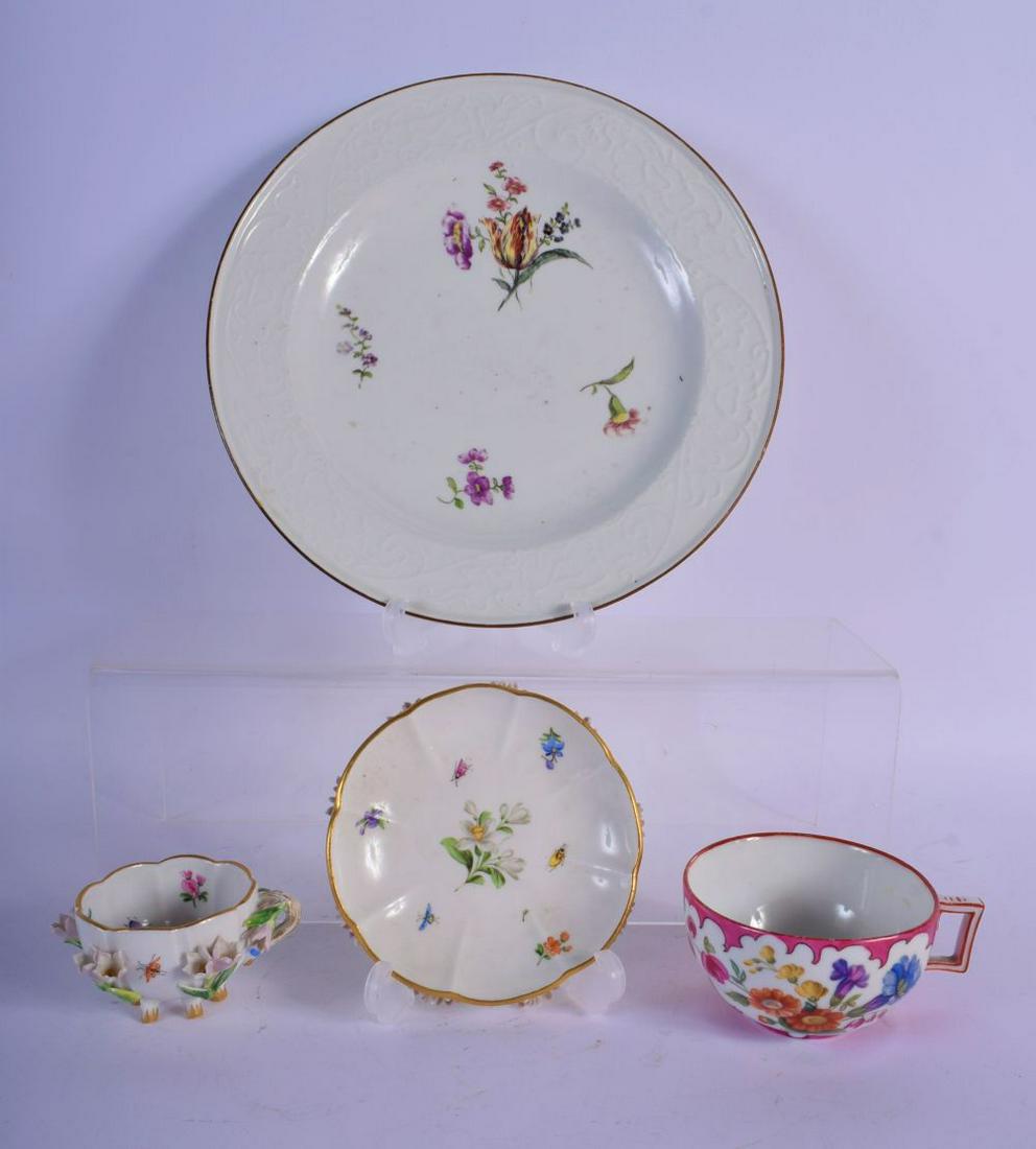 MEISSEN SIX FOOTED FLORAL ENCRUSTED CUP AND SAUCER: MEISSEN SIX FOOTED FLORAL ENCRUSTED CUP AND SAUCER PAINTED WITH FLOWERS, A MEISSEN TEACUP PAINTED WITH FLOWERS IN IRREGULAR CARTOUCHES AND A CRIMSON GROUND AND A MEISSEN PLATE WITH MOULDED BORDER PAIN