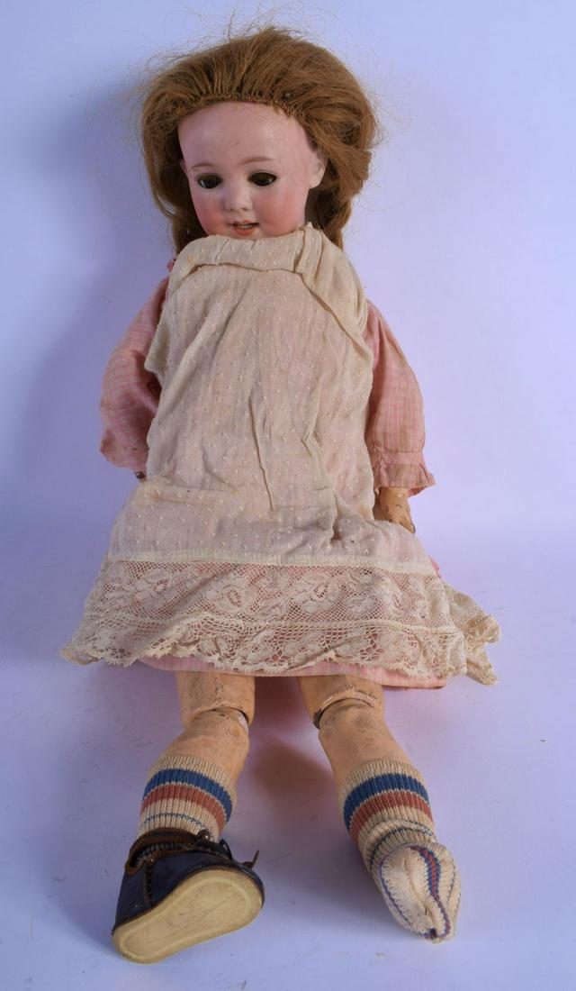 AN ARMAND MARSEILLE BISQE HEADED DOLL. 40 cm long. (1 of 4)
