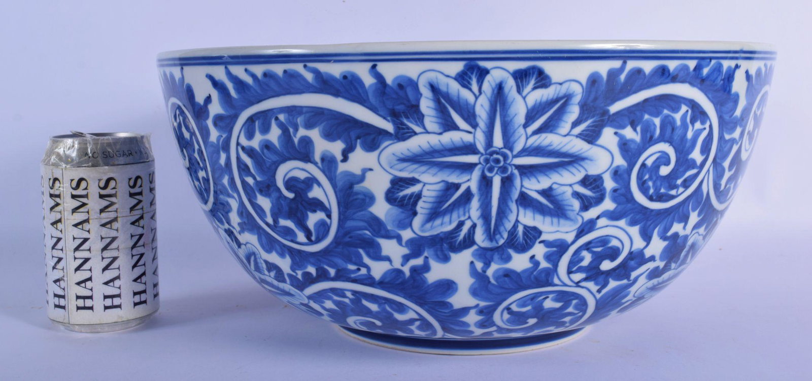 A LARGE 19TH CENTURY CONTINENTAL BLUE AND WHITE: A LARGE 19TH CENTURY CONTINENTAL BLUE AND WHITE PORCELAIN BOWL well painted with bold floral sprays. 32 cm x 17 cm.