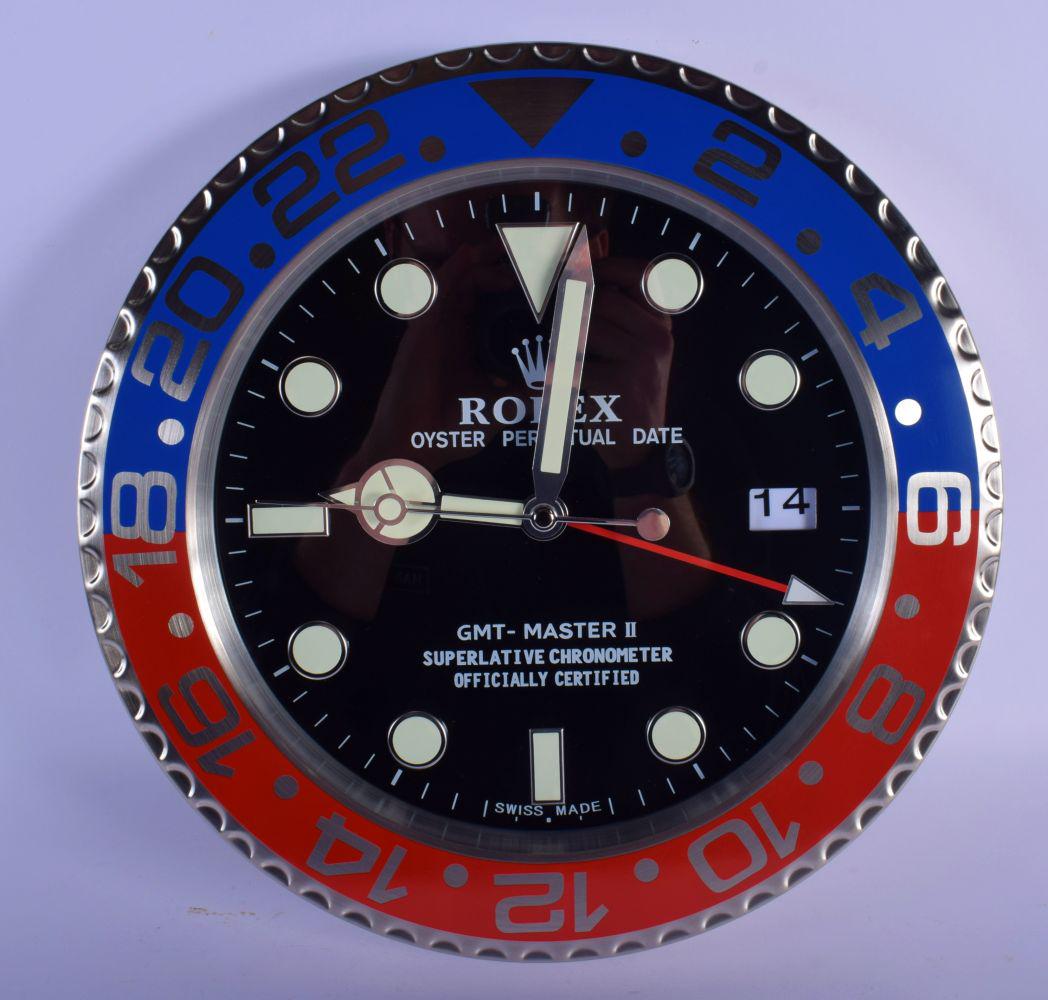 A ROLEX ADVERTISING DEALER DISPLAY HANGING WALL CLOCK.: A ROLEX ADVERTISING DEALER DISPLAY HANGING WALL CLOCK. 30 cm diameter.
