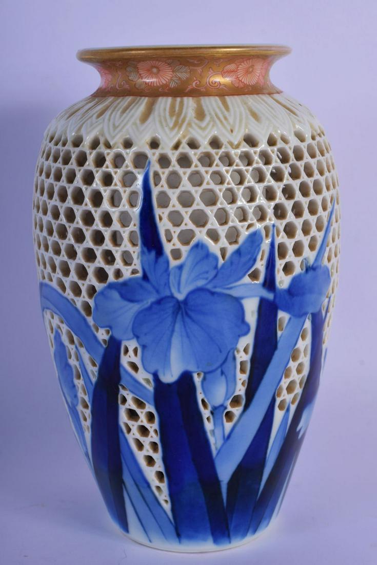 AN EARLY 20TH CENTURY JAPANESE MEIJI PERIOD RETICULATED: AN EARLY 20TH CENTURY JAPANESE MEIJI PERIOD RETICULATED VASE painted with blue foliage. 19 cm high.