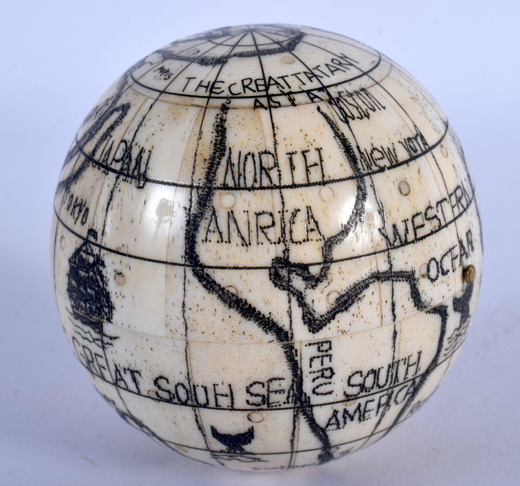 A CONTEMPORARY BONE GLOBE COMPASS. 7cm diameter,: A CONTEMPORARY BONE GLOBE COMPASS. 7cm diameter, weight 253g