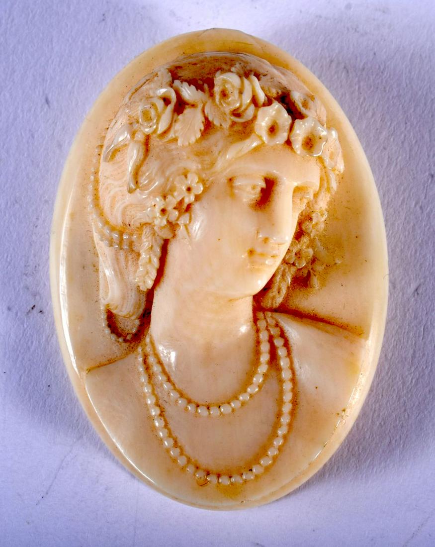 AN OVAL IVORY BROOCH CARVED WITH A CLASSICAL FEMALE (1 of 2)