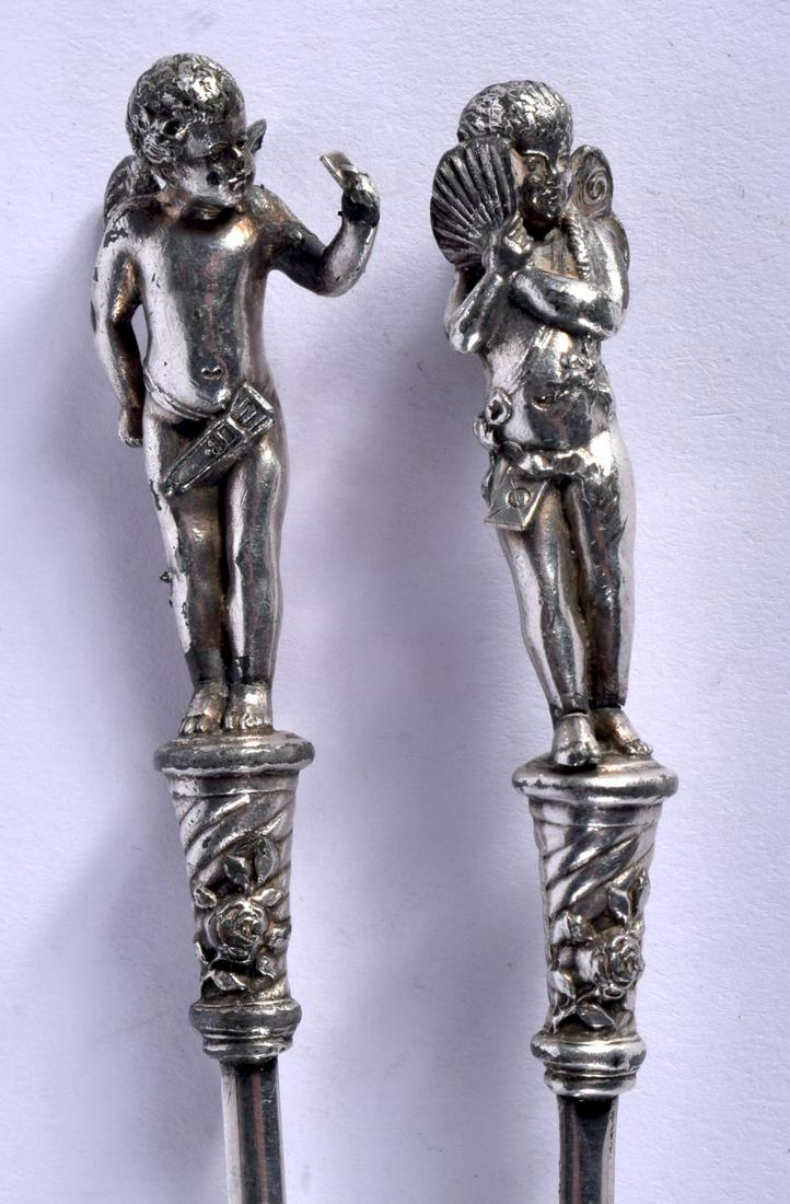 TWO SILVER PLATED MEAT SKEWERS WITH CHERUB FINIALS (1 of 3)