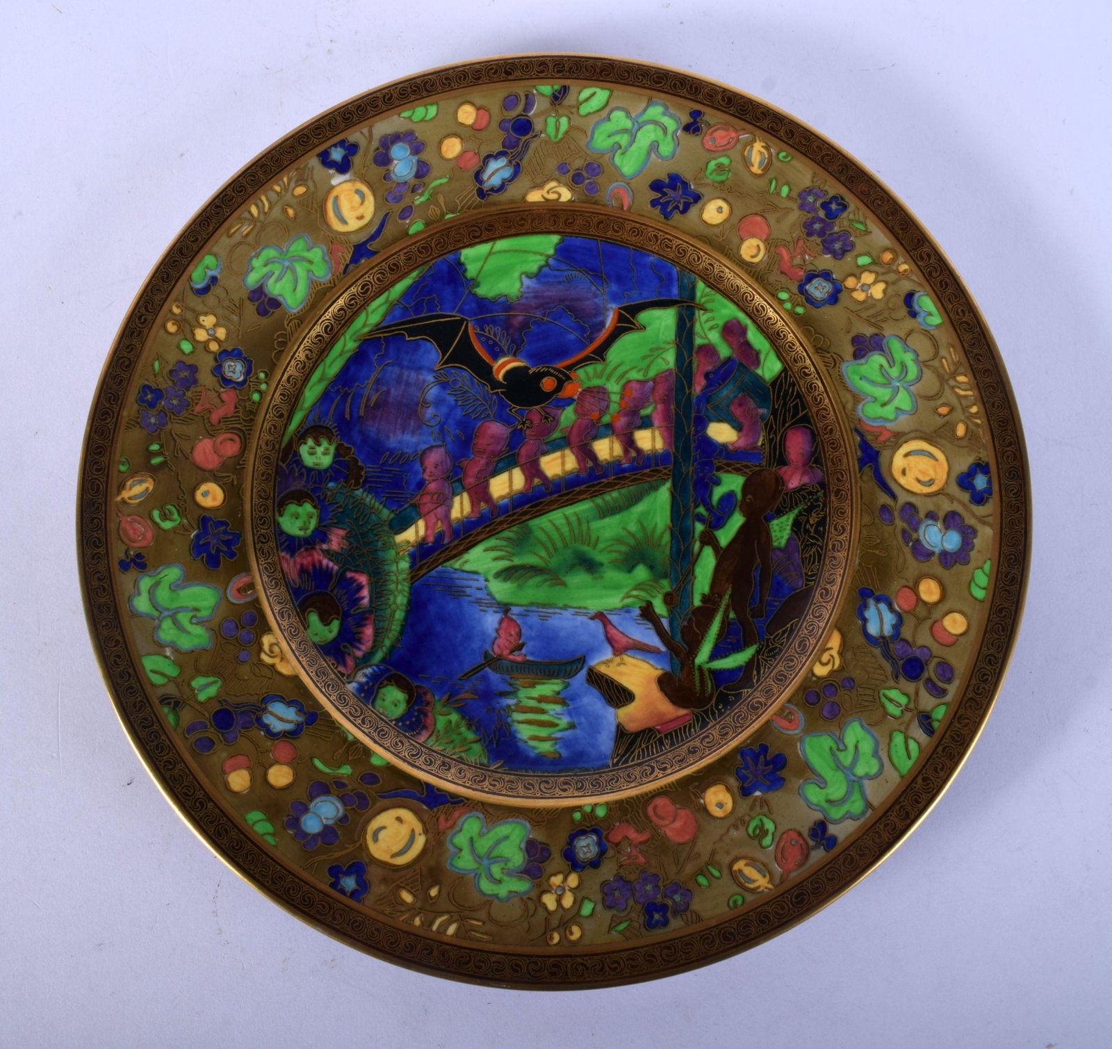 A FINE WEDGWOOD FAIRYLAND LUSTRE CIRCULAR PLATE by: A FINE WEDGWOOD FAIRYLAND LUSTRE CIRCULAR PLATE by Daisy Makeig Jones, painted with figures and landscapes. 27 cm wide.