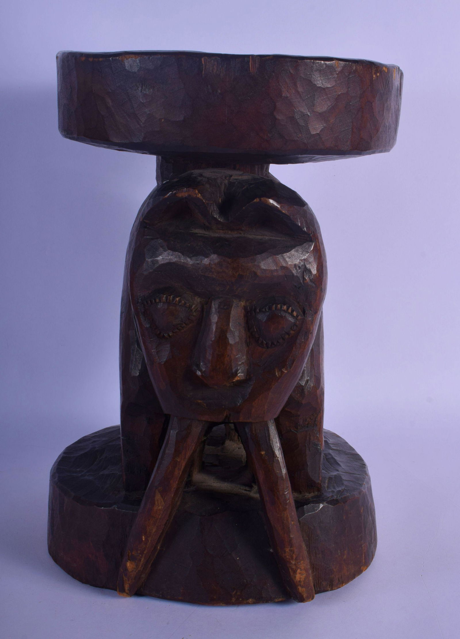 A LARGE VINTAGE AFRICAN TRIBAL CARVED WOOD STOOL formed: A LARGE VINTAGE AFRICAN TRIBAL CARVED WOOD STOOL formed as a long tusked animal. 32 cm x 22 cm.