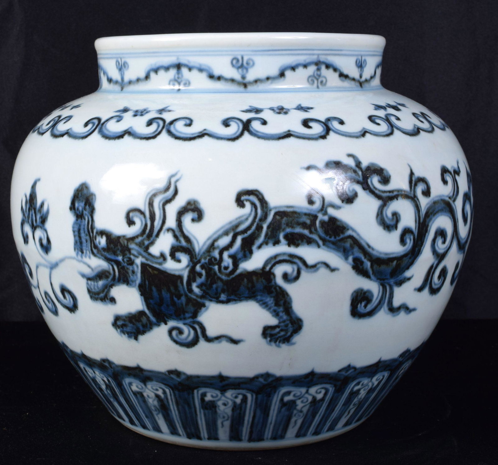 A Chinese porcelain blue and white 'kui dragon' jar: A Chinese porcelain blue and white 'kui dragon' jar decorated with a dragon and symmetrical patterns. 21 x 26cm