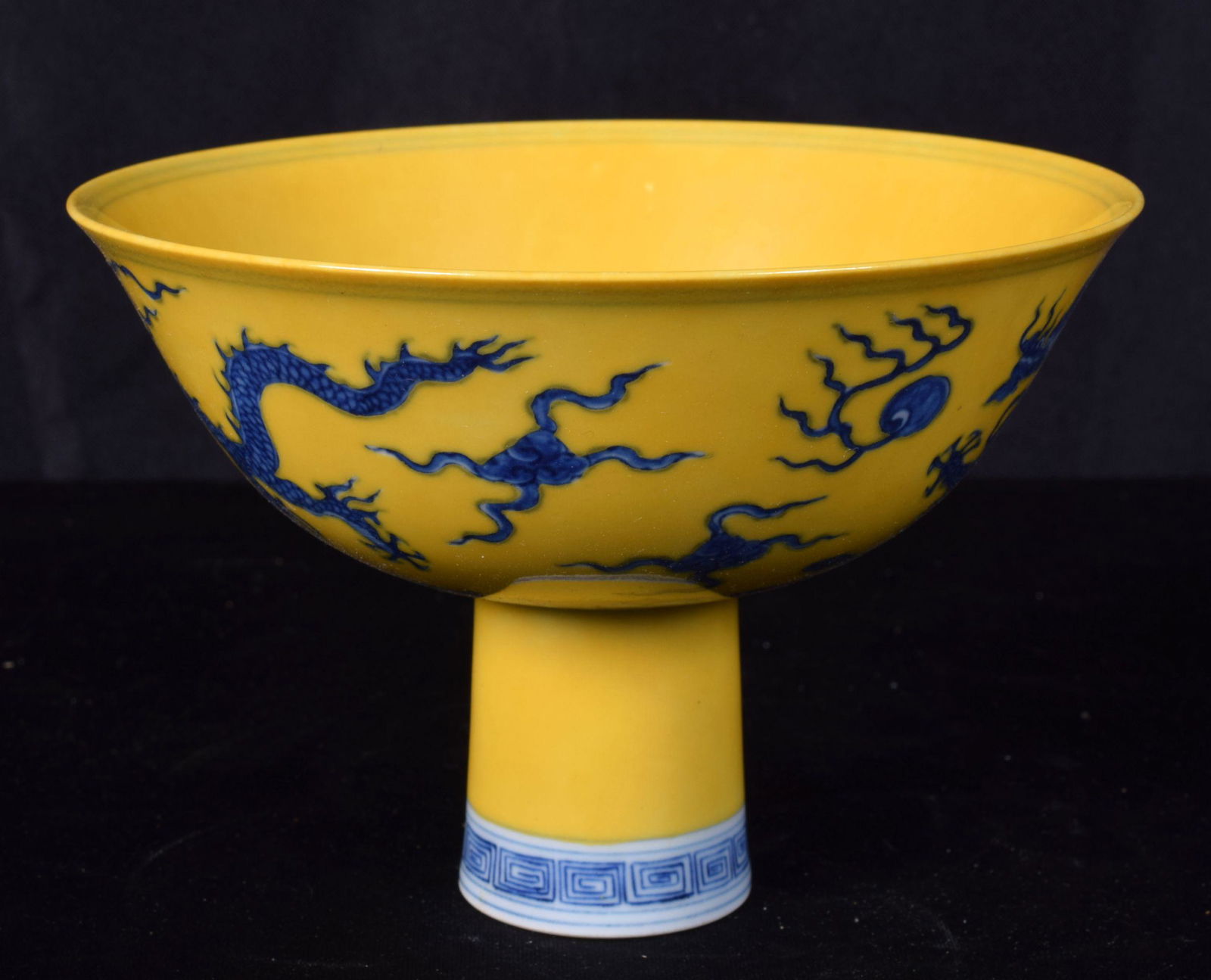 A Chinese porcelain yellow ground stem cup decorated (1 of 4)