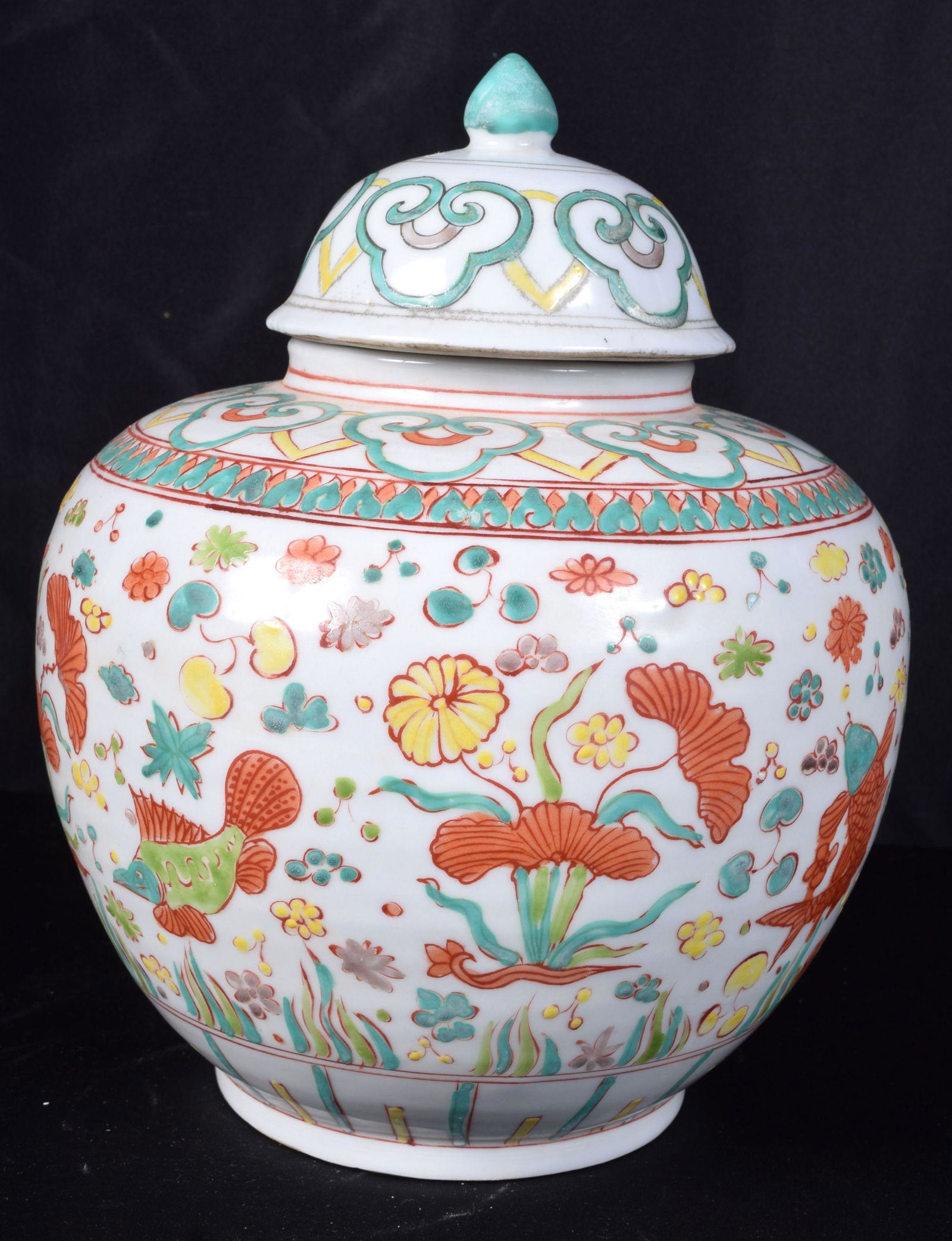 A Chinese porcelain Wucai jar and cover decorated with (1 of 3)