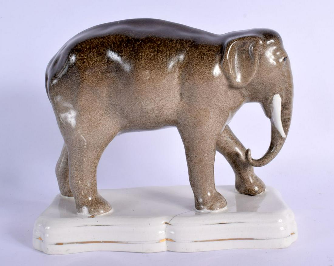 A RARE 19TH CENTURY STAFFORDSHIRE FIGURE OF JUMBO THE ELEPHANT modelled roaming upon a shaped base. (1 of 4)