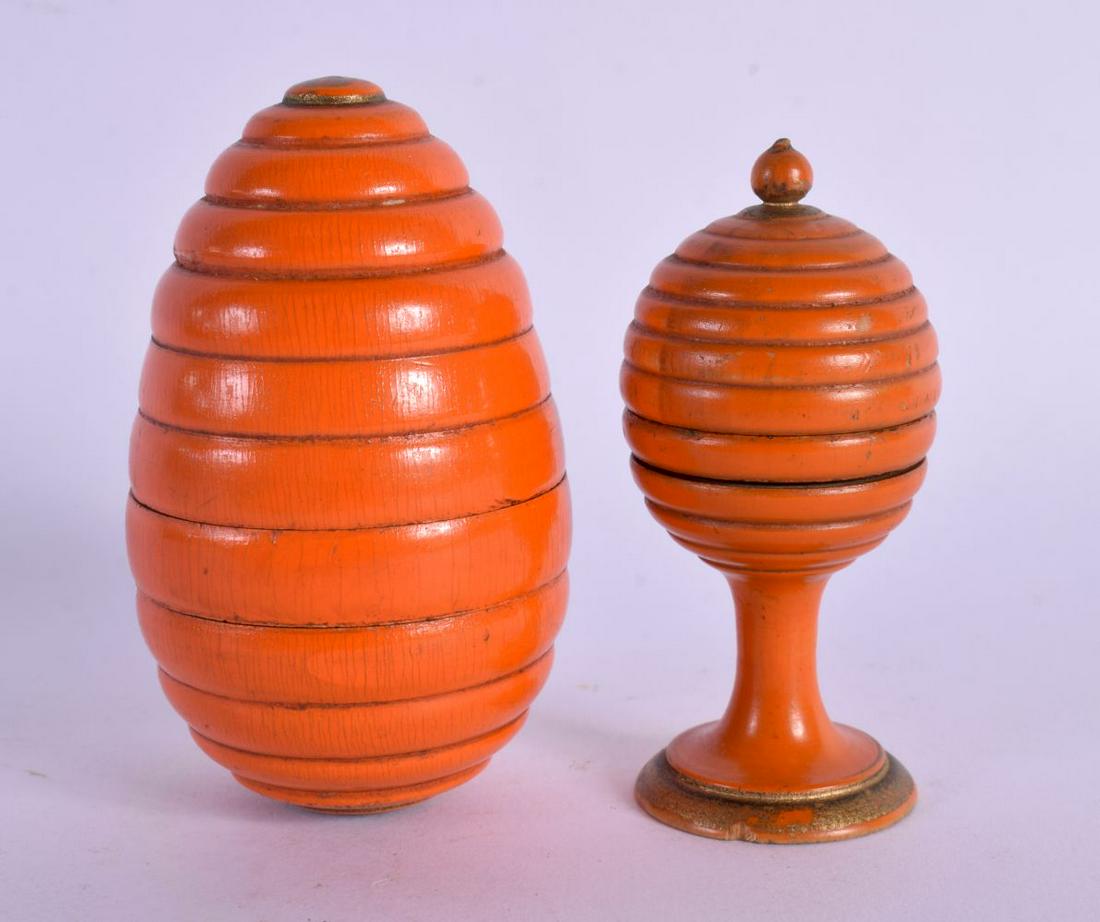 AN UNUSUAL ANTIQUE ORANGE PAINTED TREEN BOX AND COVER together with another. 7.5 cm x 3.5 cm. (2) (1 of 3)