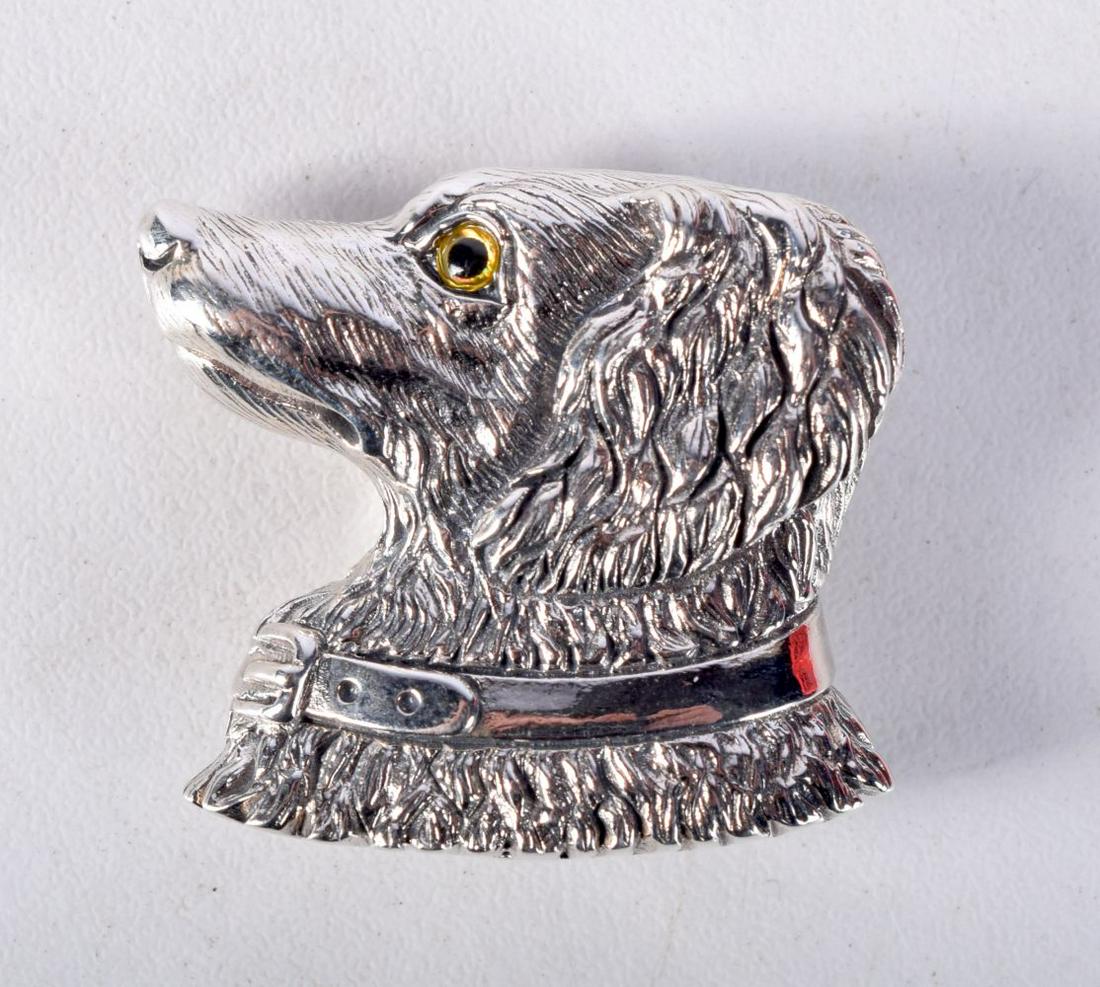 A STERLING SILVER DOG BROOCH.  Stamped Sterling, 2.8cm x 3.2cm, weight 12.4g (1 of 2)