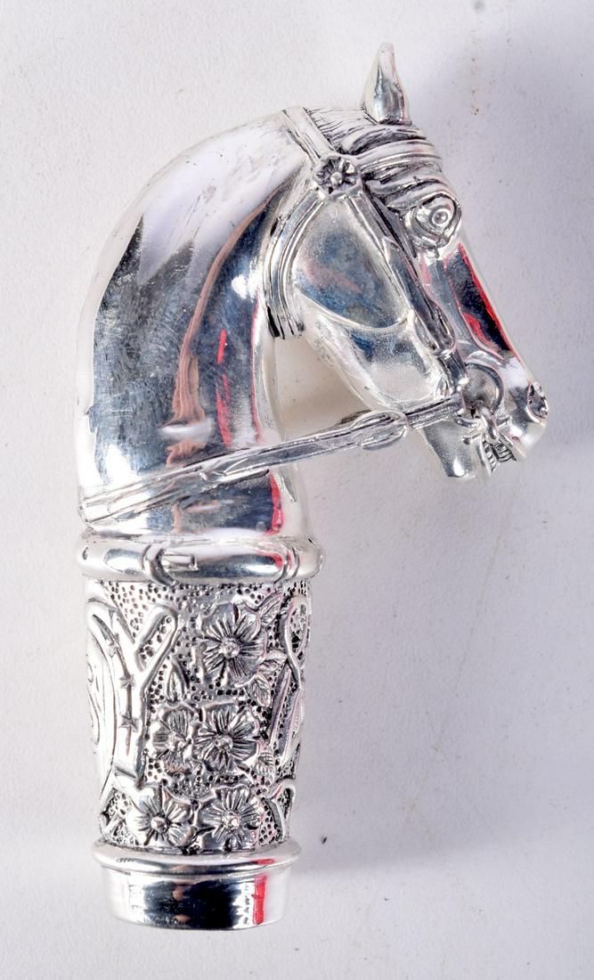 A CONTINENTAL SILVER CANE HANDLE IN THE FORM OF A HORSES HEAD.  Stamped 800, 8.7cm x 4.8cm, weight 6 (1 of 3)